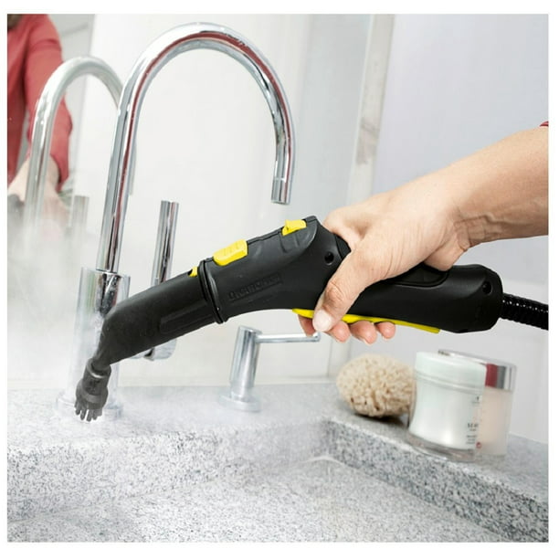 Limpiador a vapor para limpiar la casa sale vapor del cepillo