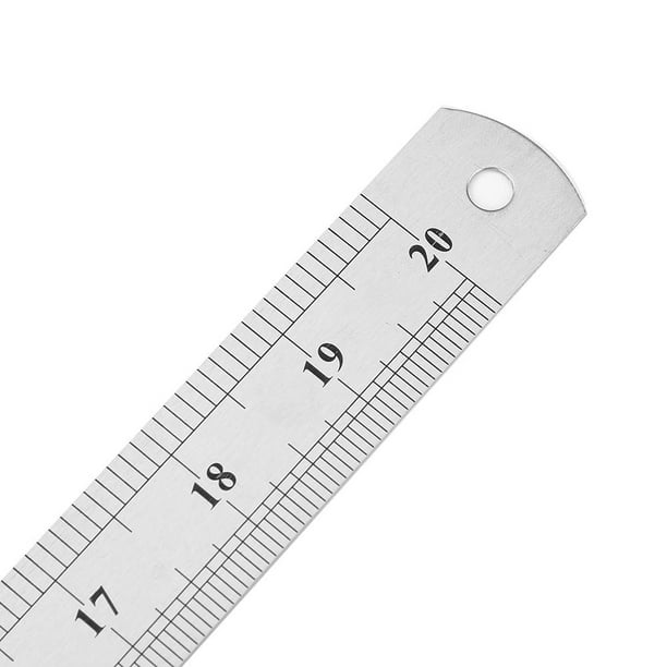 Regla metálica, herramienta de medición. Los suministros de