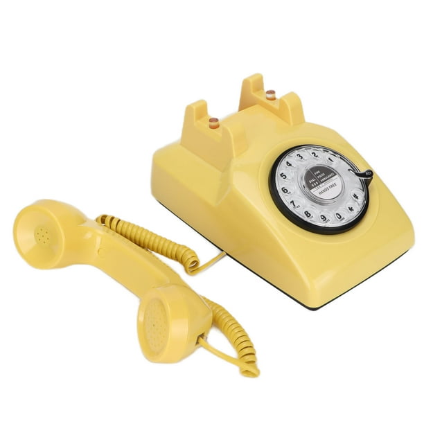 Teléfono vintage con esfera giratoria teléfono amarillo