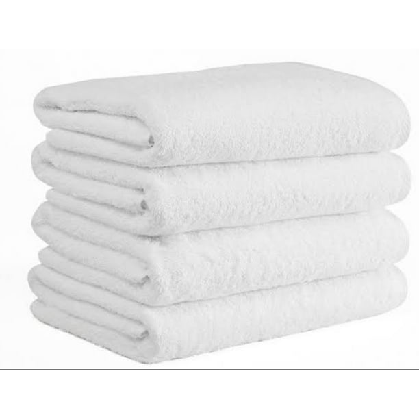 Toallas blancas de algodón limpias y enrolladas en el interior de un hotel  ia generativa