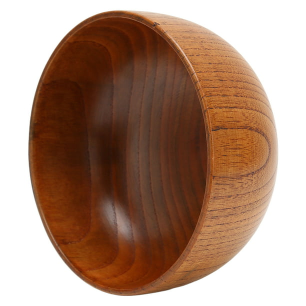 Un cuenco de madera con el diseño de un diseño