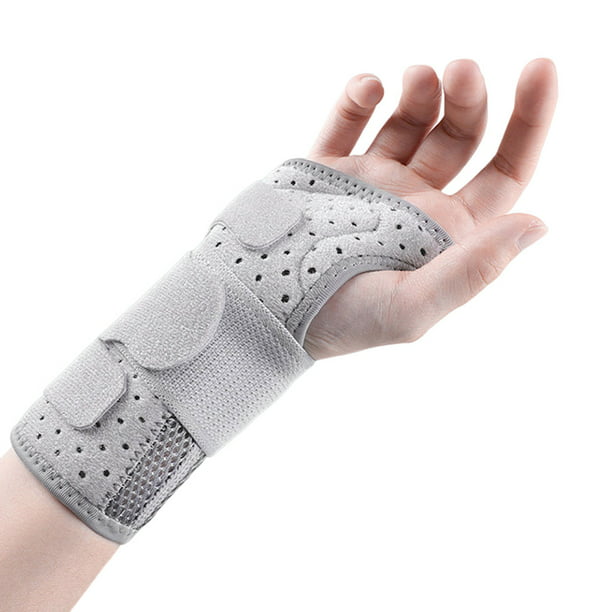 Man39s mano con muñequera terapéutica para aliviar el dolor de esguince de  muñeca sobre fondo blanco puro